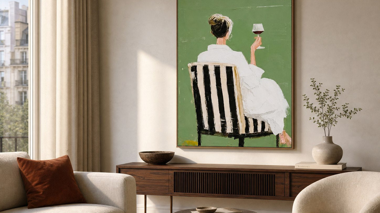 Modern feminine figurative wall art above a walnut console in a contemporary living room