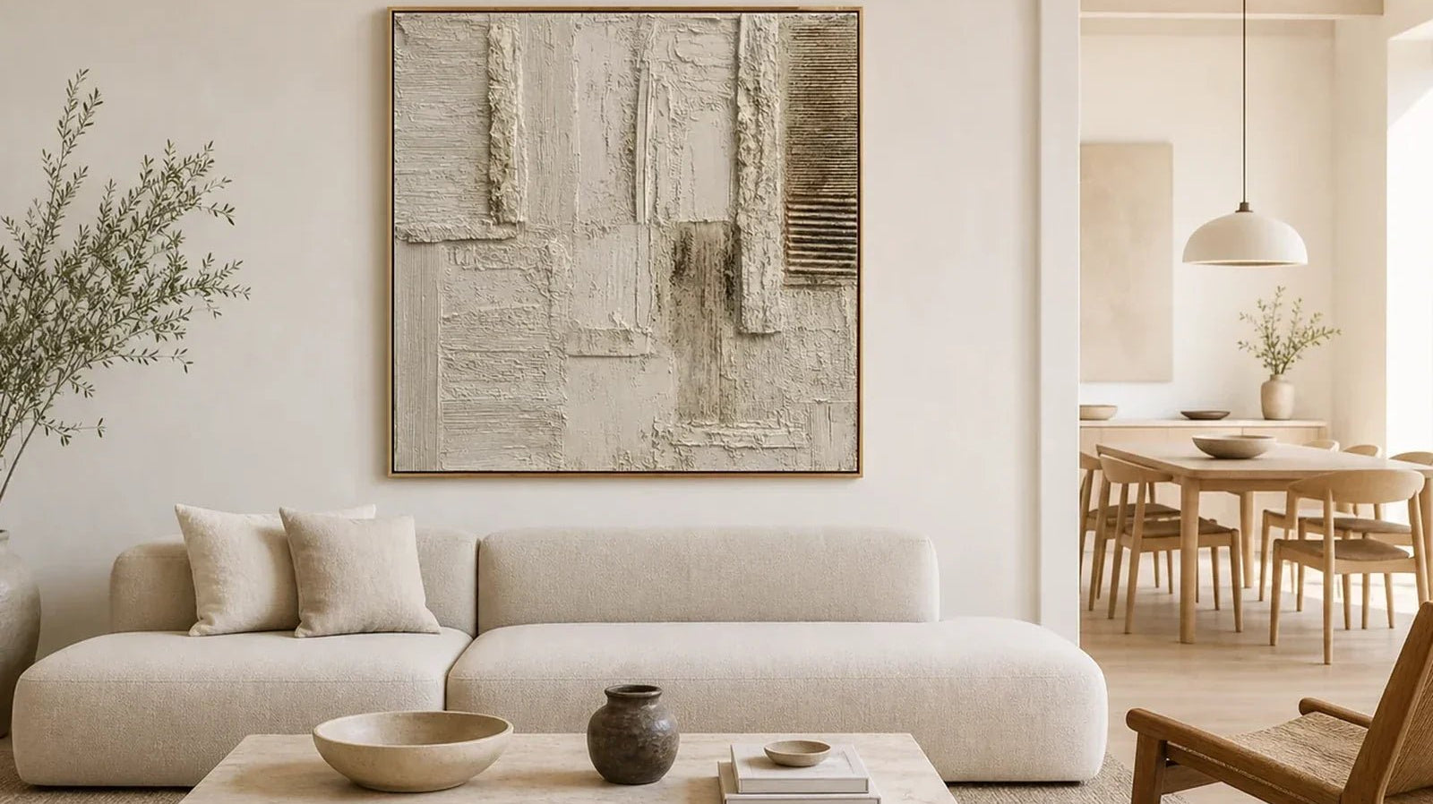 Hand-painted oatmeal and cream textured minimalist wall art above a linen sofa in an open-plan living room