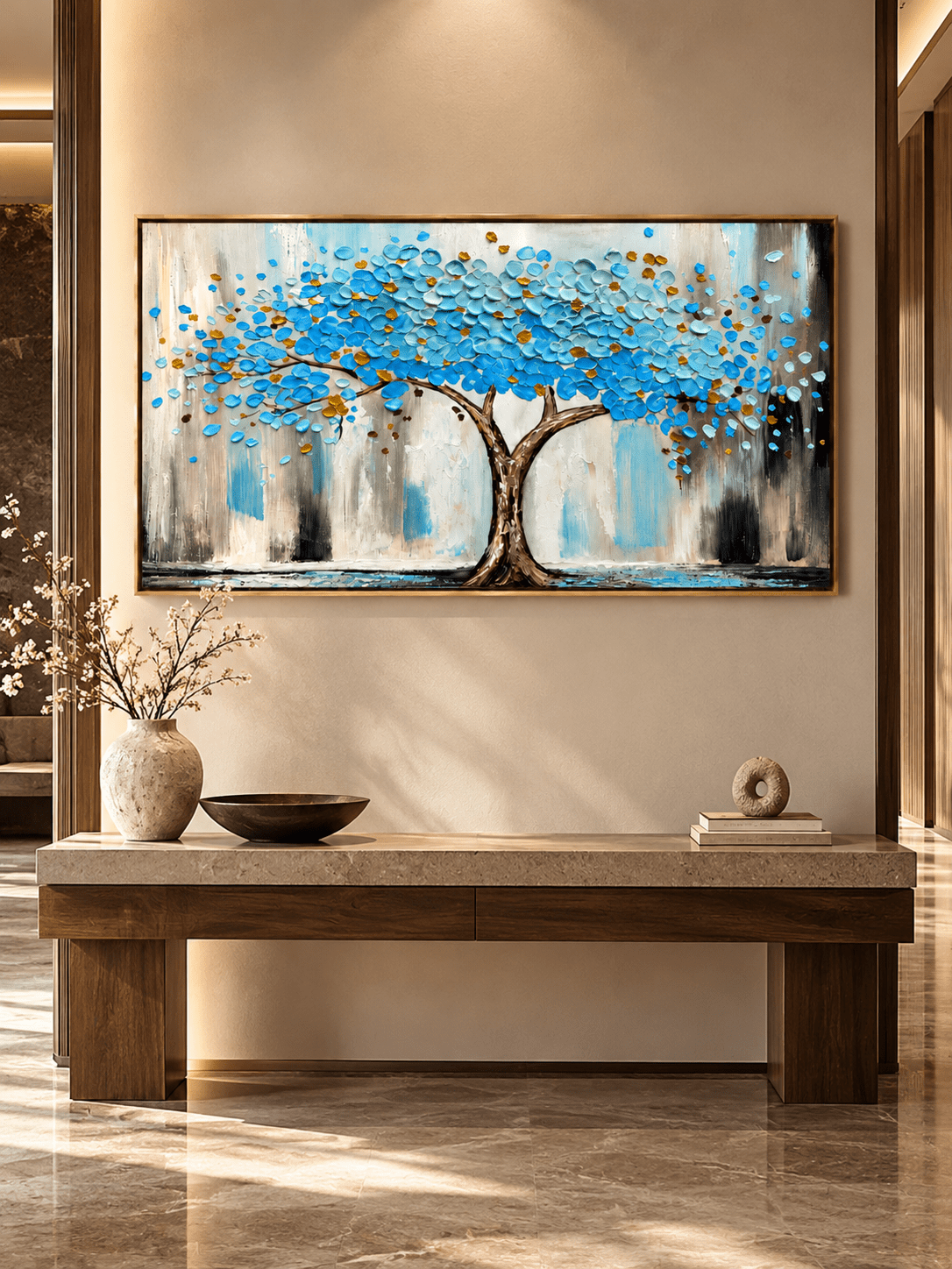 Textured Tree of Life canvas art with blue leaves and gold accents displayed in a bright modern entryway.