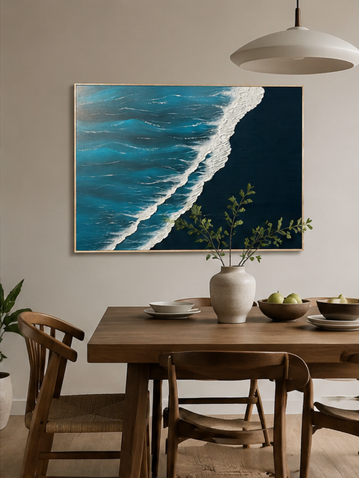 Hand-painted ocean wave wall art displayed in a modern open-plan dining room with natural wood decor