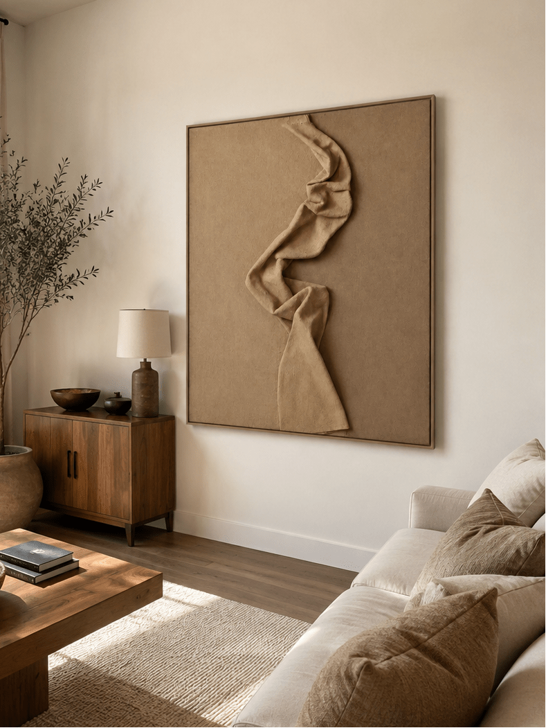 Neutral sculptural wall art displayed in an organic modern living room