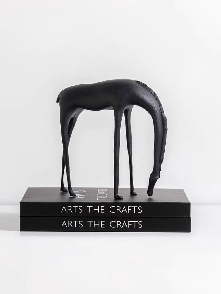 Modern minimalist drinking horse sculpture in matte black metal– elegant home decor for shelf, console, or desk styling