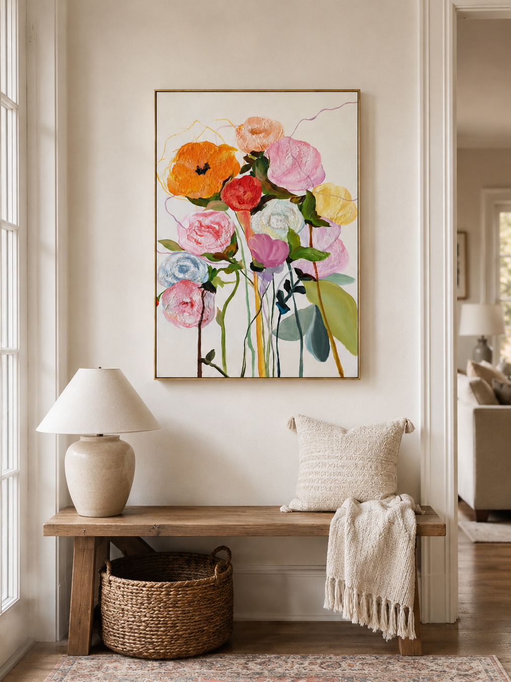 Vertical textured flower wall art displayed above a console table in a welcoming modern entryway