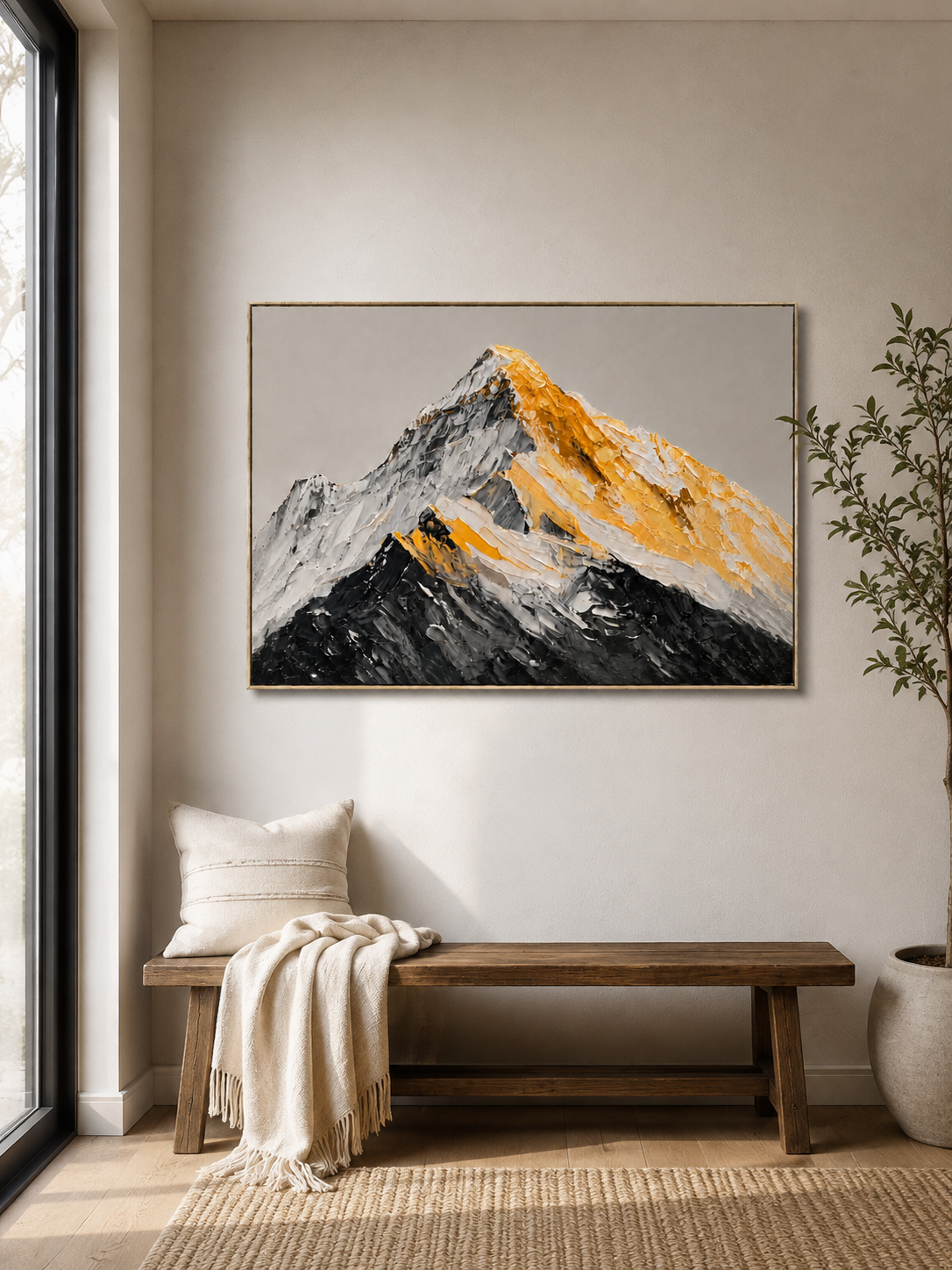 Black and gold mountain wall art above a console in a refined contemporary entryway
