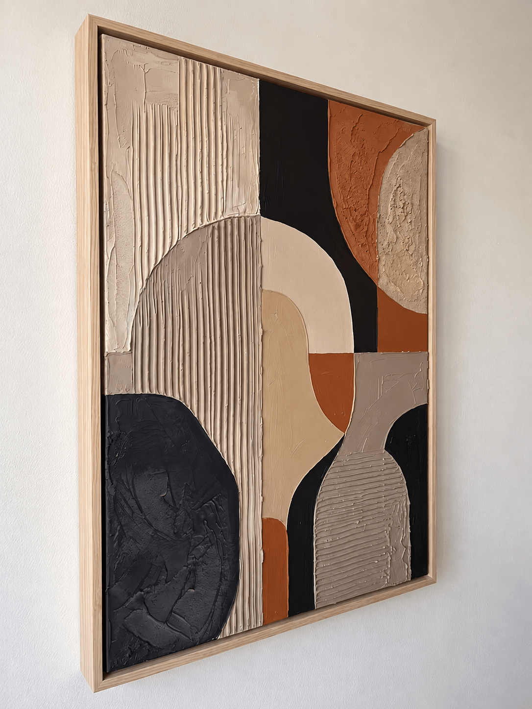 Side angle view of geometric abstract textured art, showing the 3D relief and natural wood frame thickness.
