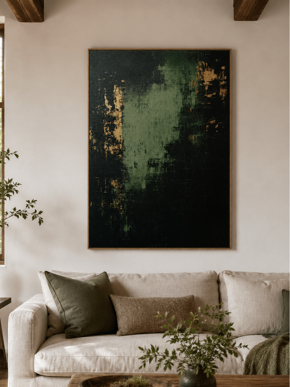 Dark green abstract painting displayed above neutral furniture in an organic modern living room