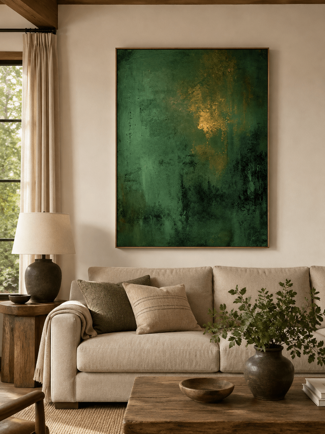 Emerald green abstract painting displayed above neutral furniture in an organic modern living room
