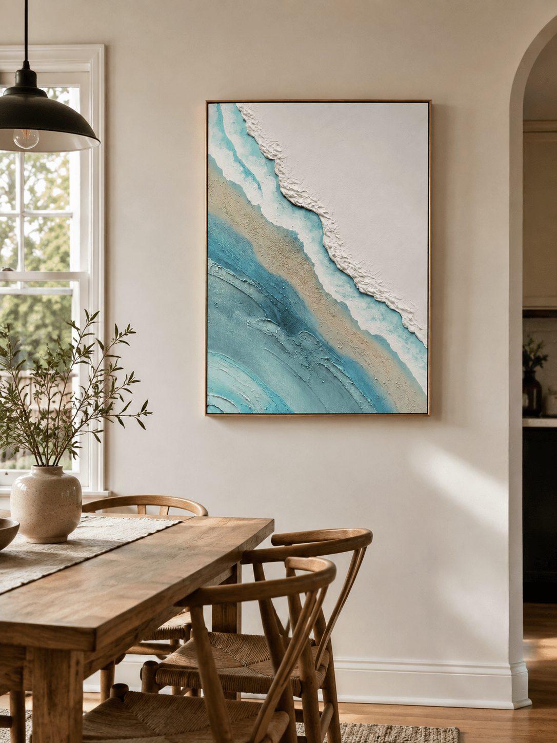 Textured ocean shoreline canvas styled in a bright open-plan dining room with neutral décor