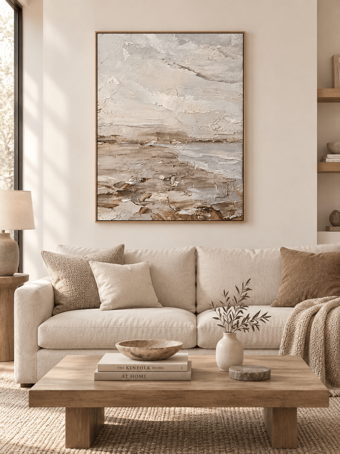 Large vertical neutral textured coastal wall art displayed in an organic modern cream living room