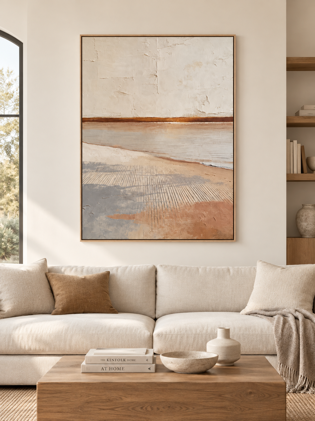 Large vertical terracotta coastal wall art displayed in a cream organic modern living room