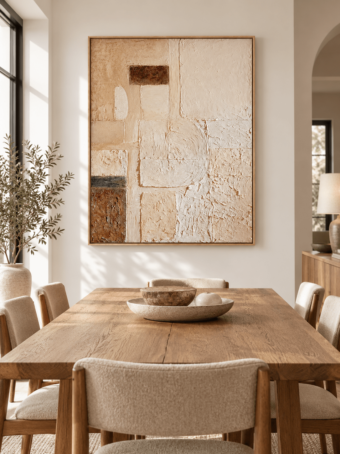 Hand-painted geometric textured wall art displayed in a modern organic open-plan dining room