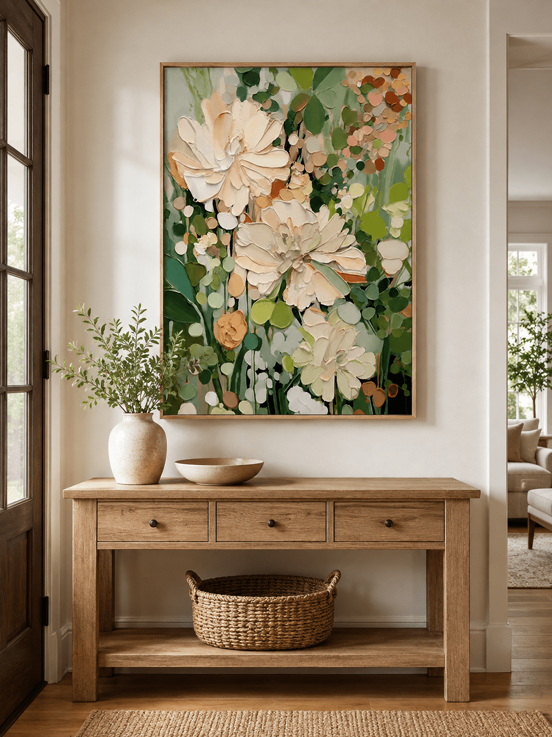 Vertical textured floral wall art displayed above an entryway console in an organic modern interior