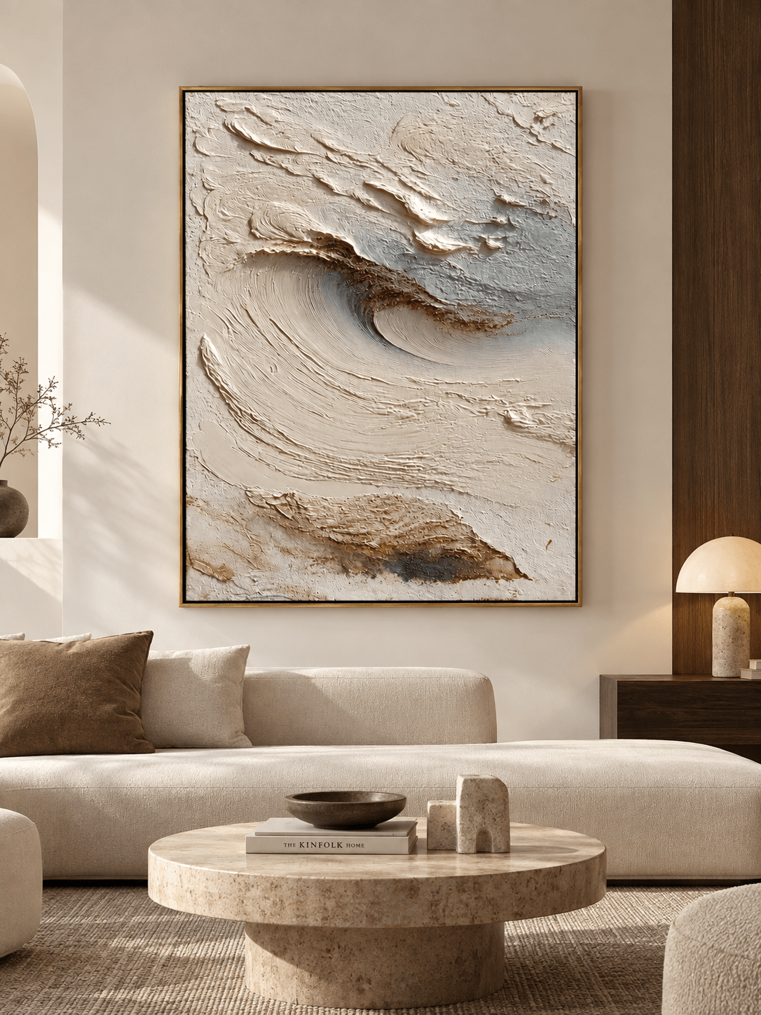 Large ivory textured abstract wave wall art displayed above a sofa in a warm minimalist living room