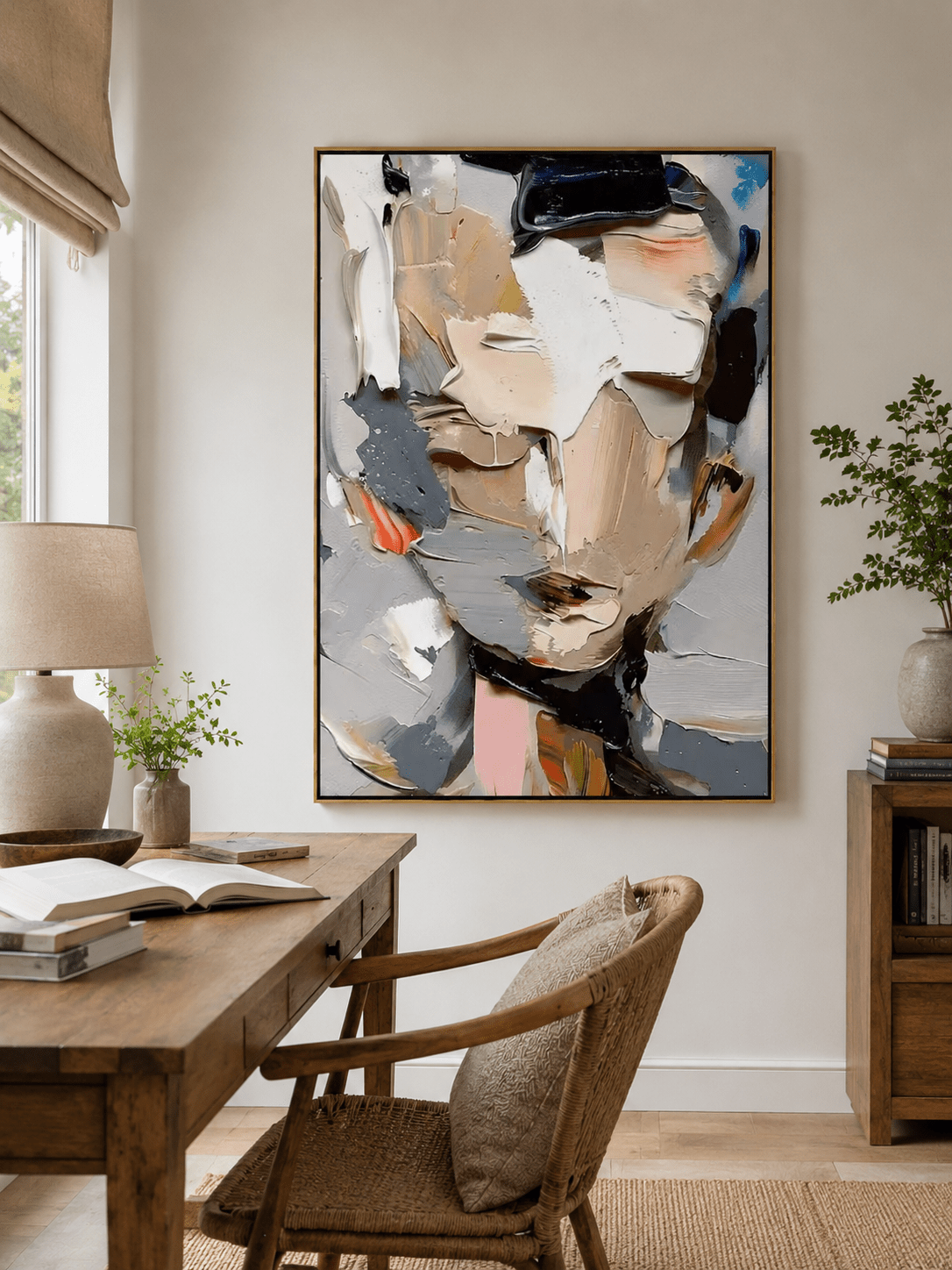 Textured face wall art above an entryway console in an organic modern foyer