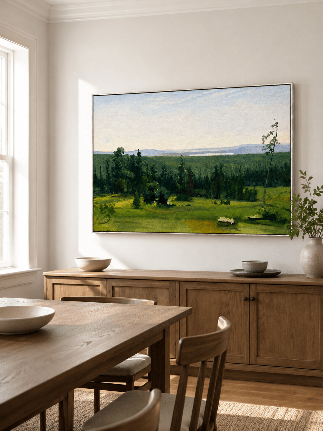 Hand-painted green landscape wall art displayed in a dining room with natural wood furniture