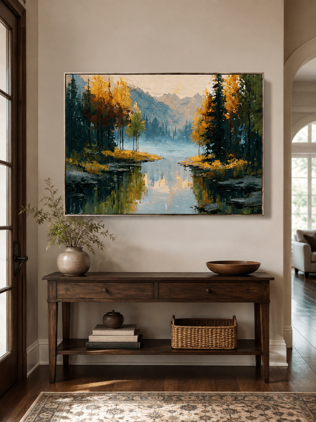 Horizontal autumn mountain landscape displayed above a wood console in a modern entryway