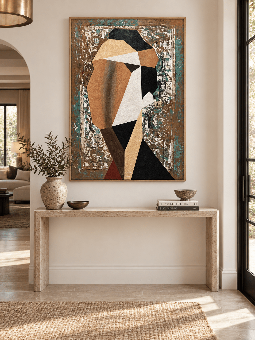 Vertical abstract woman portrait with geometric shapes displayed above a console in a contemporary entryway