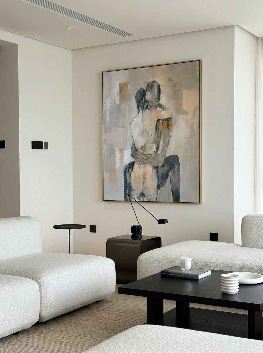 Hand-painted abstract romantic couple canvas painting featuring a seated embrace in neutral beige, gray, ivory, and black tones with textured contemporary brushstrokes.