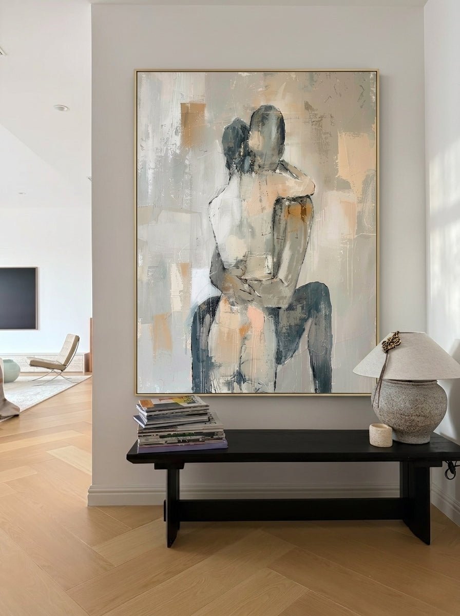 Hand-painted abstract romantic couple canvas painting featuring a seated embrace in neutral beige, gray, ivory, and black tones with textured contemporary brushstrokes.