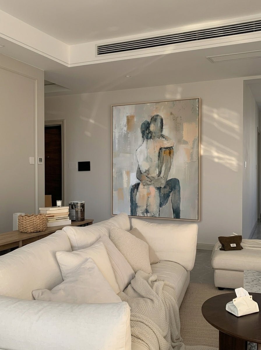 Hand-painted abstract romantic couple canvas painting featuring a seated embrace in neutral beige, gray, ivory, and black tones with textured contemporary brushstrokes.