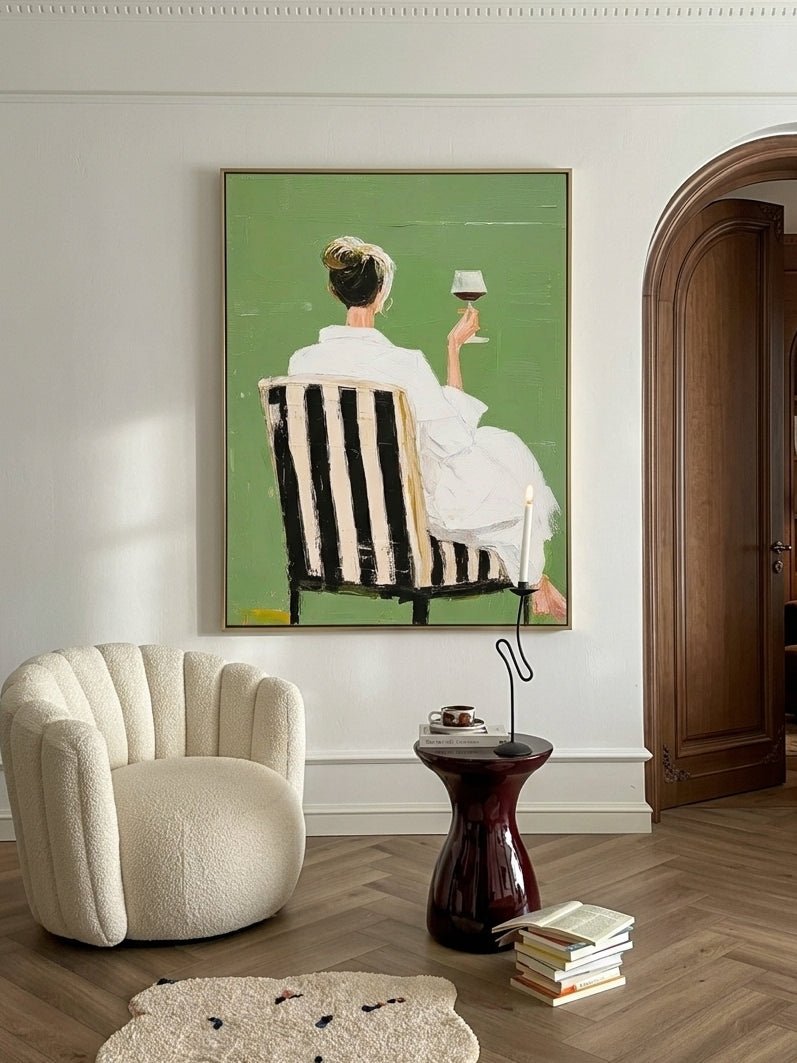 Hand painted modern feminine figurative wall art with woman holding wine glass on green background for contemporary bedroom decor