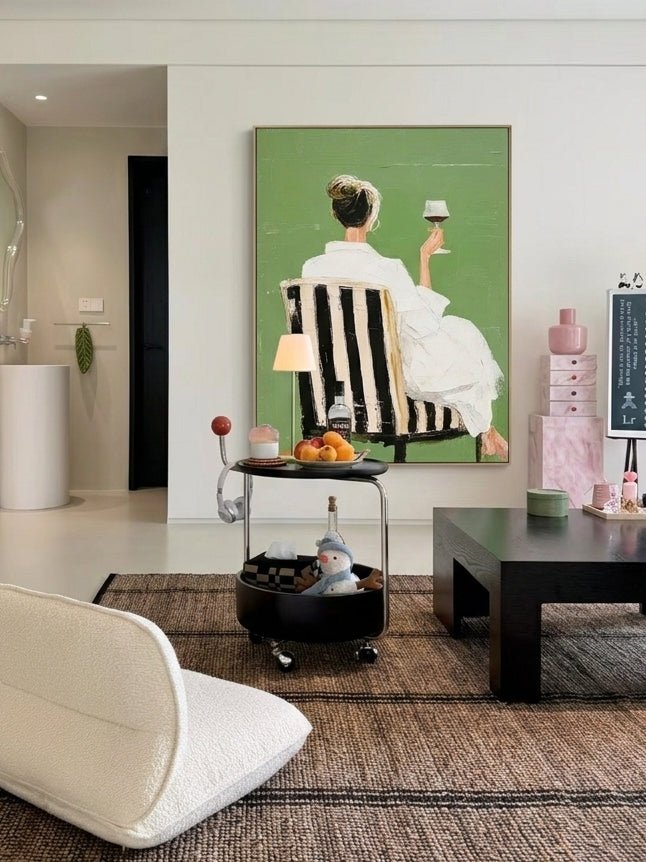 Hand painted modern feminine figurative wall art with woman holding wine glass on green background for contemporary bedroom decor