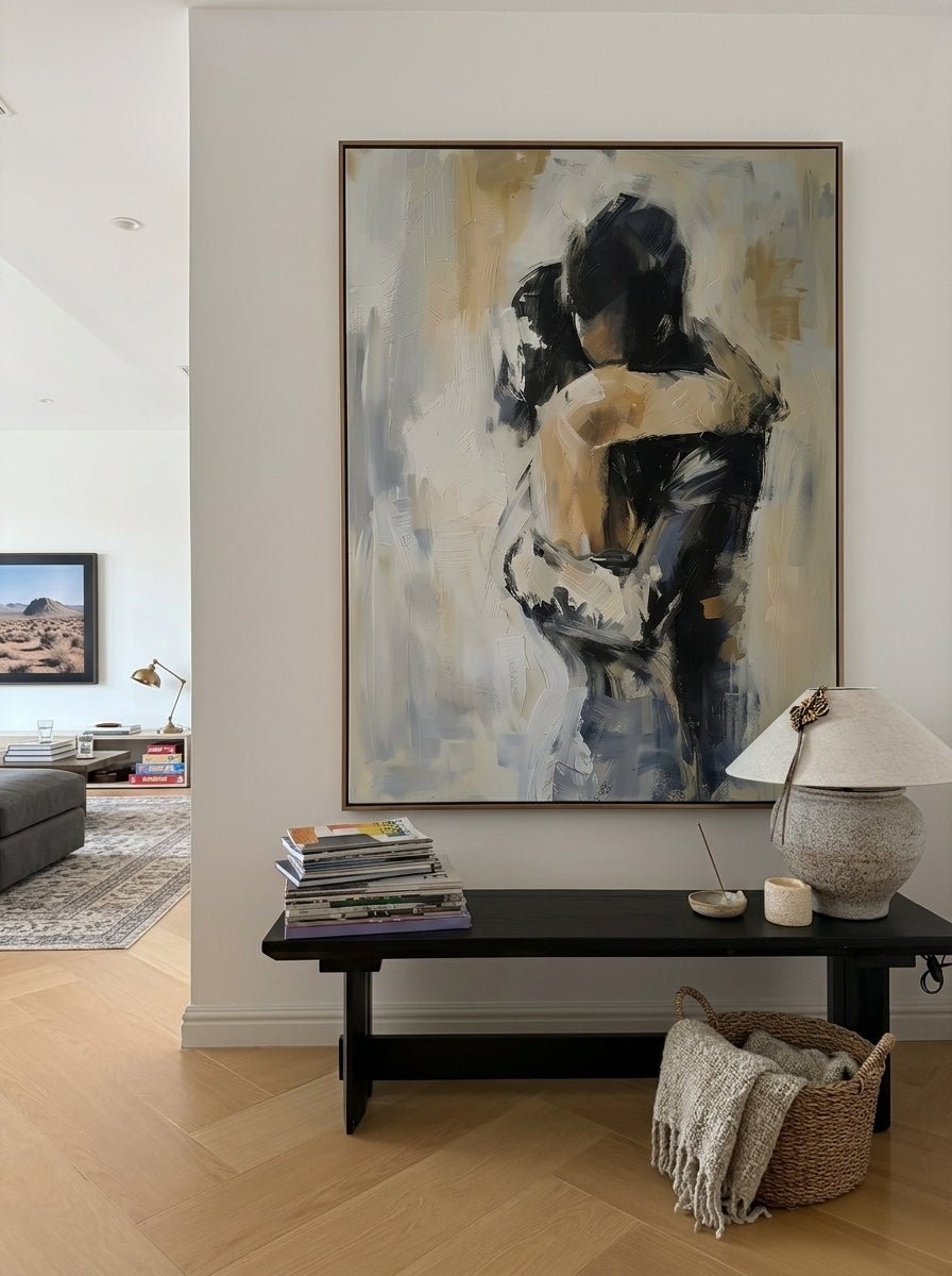 Hand-painted abstract romantic couple painting featuring two embracing figures in neutral beige, gray, black, and ivory tones with textured contemporary brushstrokes on canvas.