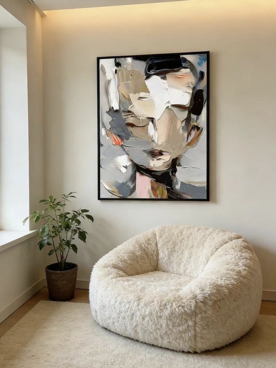 A high-definition close-up of a hand-painted abstract portrait , showing extremely thick impasto paint texture in grey, cream, and orange.