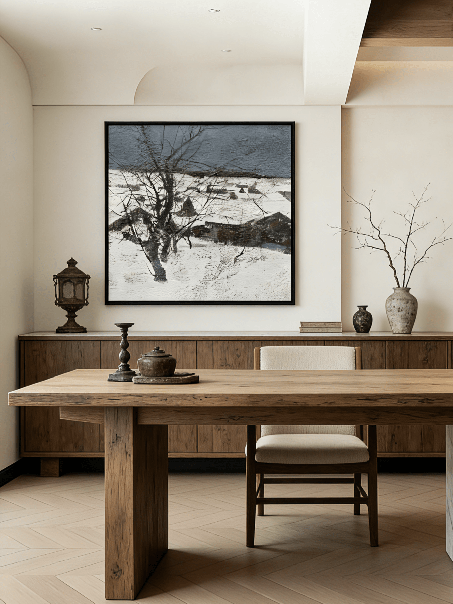Hand-painted winter landscape oil painting featuring a black tree in a snowy field under a dark grey sky with heavy texture.