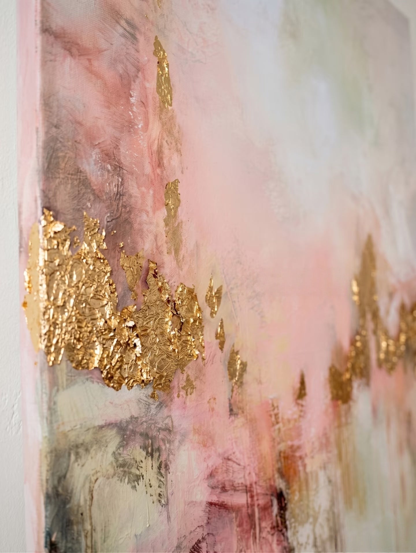 Large hand-painted modern abstract canvas painting with 3D textured gold leaf and blush pink brushstrokes by Evelyn Li for luxury master bedroom wall decor.