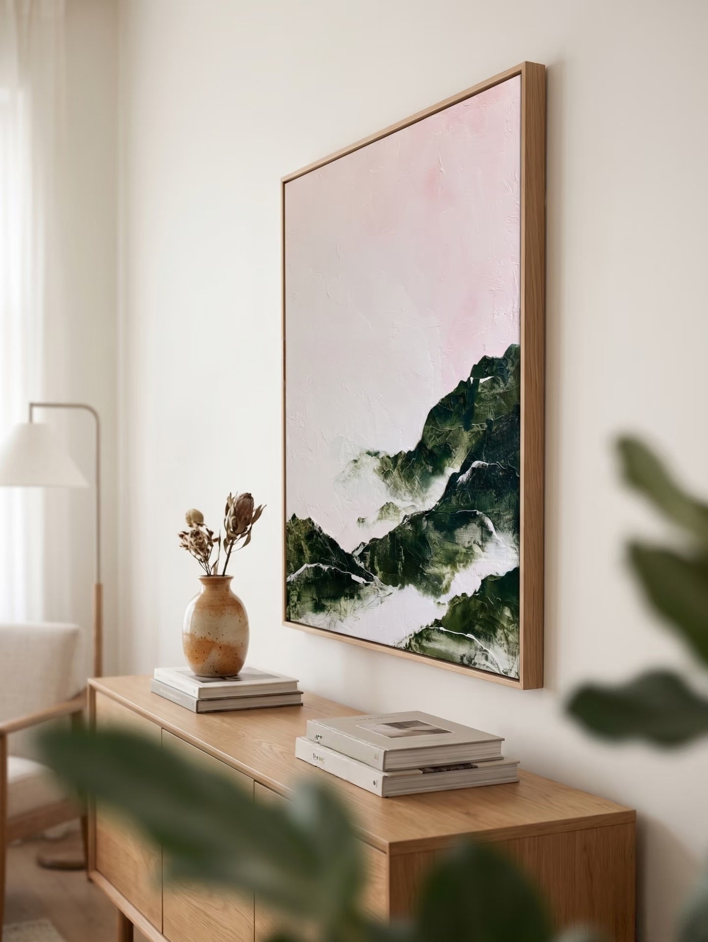 Large hand-painted modern abstract canvas painting with 3D heavy palette knife texture featuring a blush pink sky and forest green mountain range by Evelyn Li for bedroom wall decor.