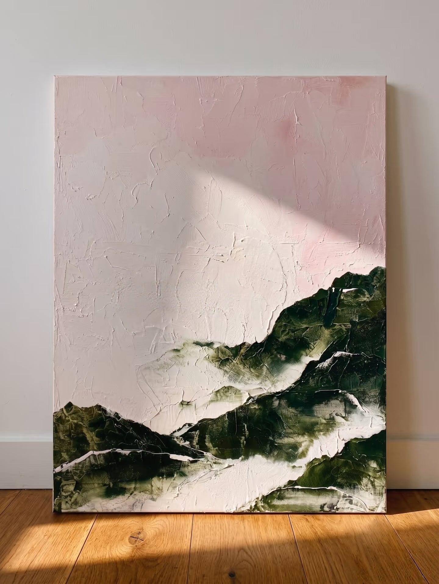 Large hand-painted modern abstract canvas painting with 3D heavy palette knife texture featuring a blush pink sky and forest green mountain range by Evelyn Li for bedroom wall decor.