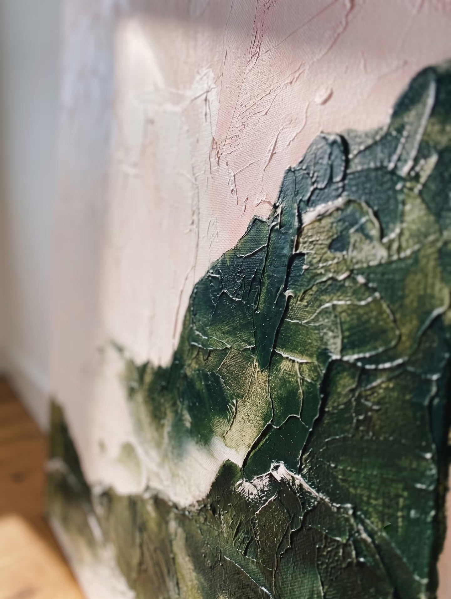 Large hand-painted modern abstract canvas painting with 3D heavy palette knife texture featuring a blush pink sky and forest green mountain range by Evelyn Li for bedroom wall decor.