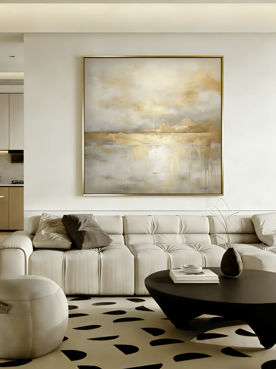 Large square hand-painted gold and white abstract painting with metallic drip texture by Evelyn Li in a luxury living room setting.