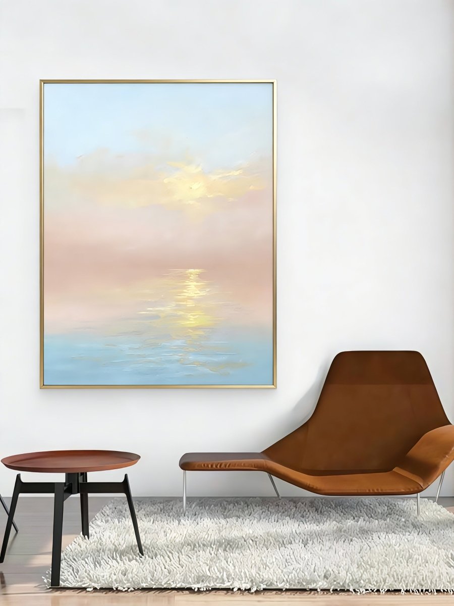 Large vertical hand-painted impressionist sunset seascape in pastel pink and blue with golden light reflections by Evelyn Li in a minimalist bedroom.