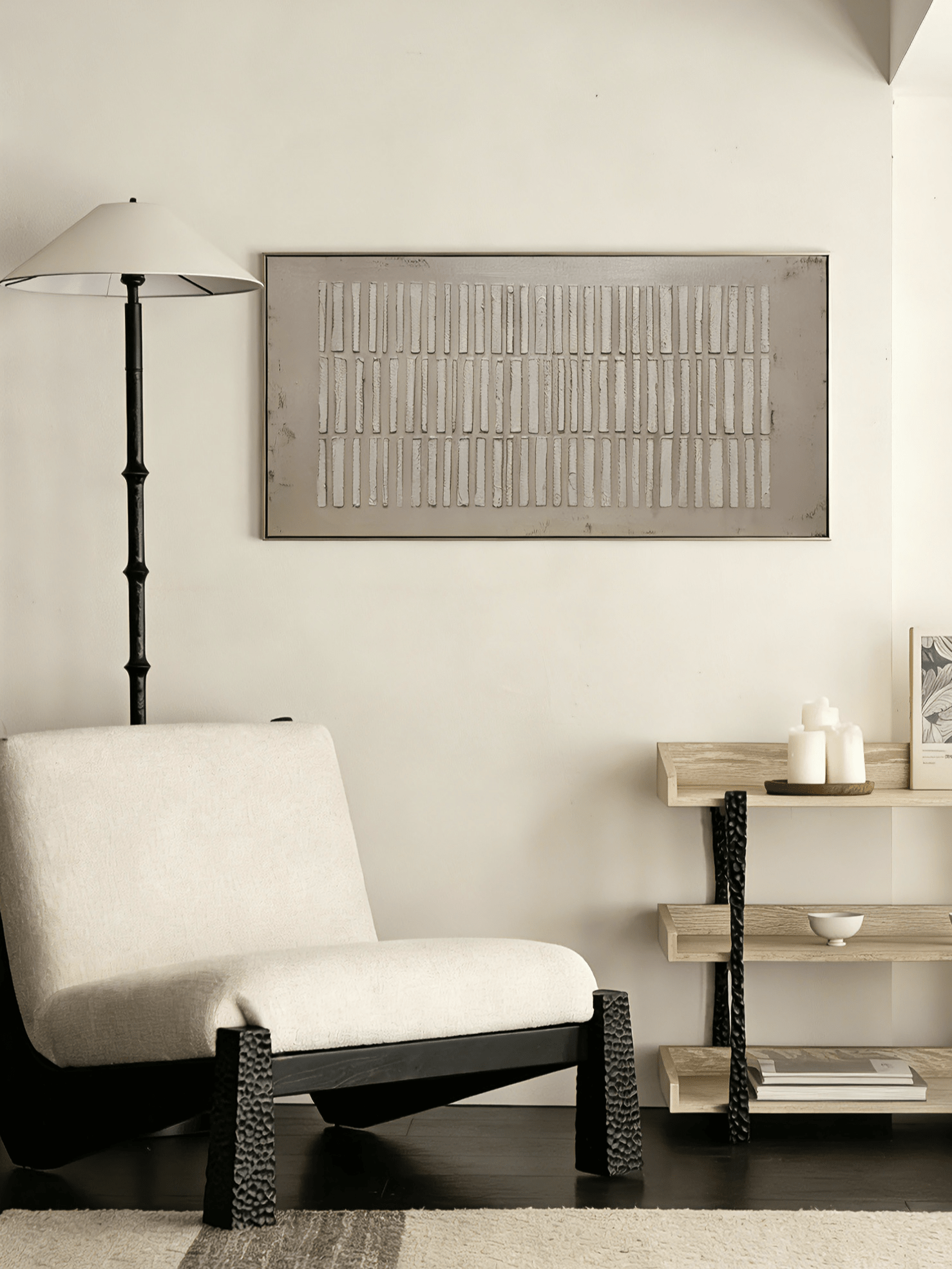 A large horizontal modern 3D relief painting by Eliot Vermeer featuring repeating vertical textured bars in white over a warm taupe background, hung above a minimalist sofa.