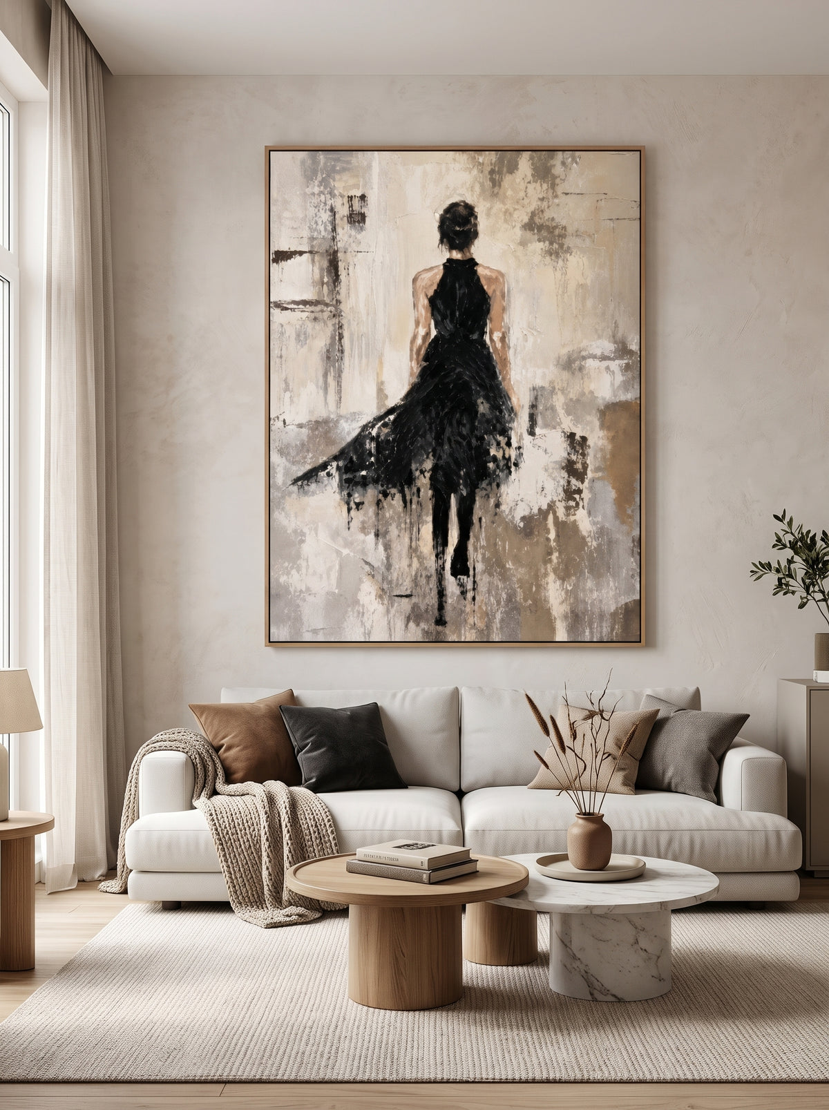 Abstract woman in black painting displayed in a modern living room with warm neutral decor and contemporary furnishings.