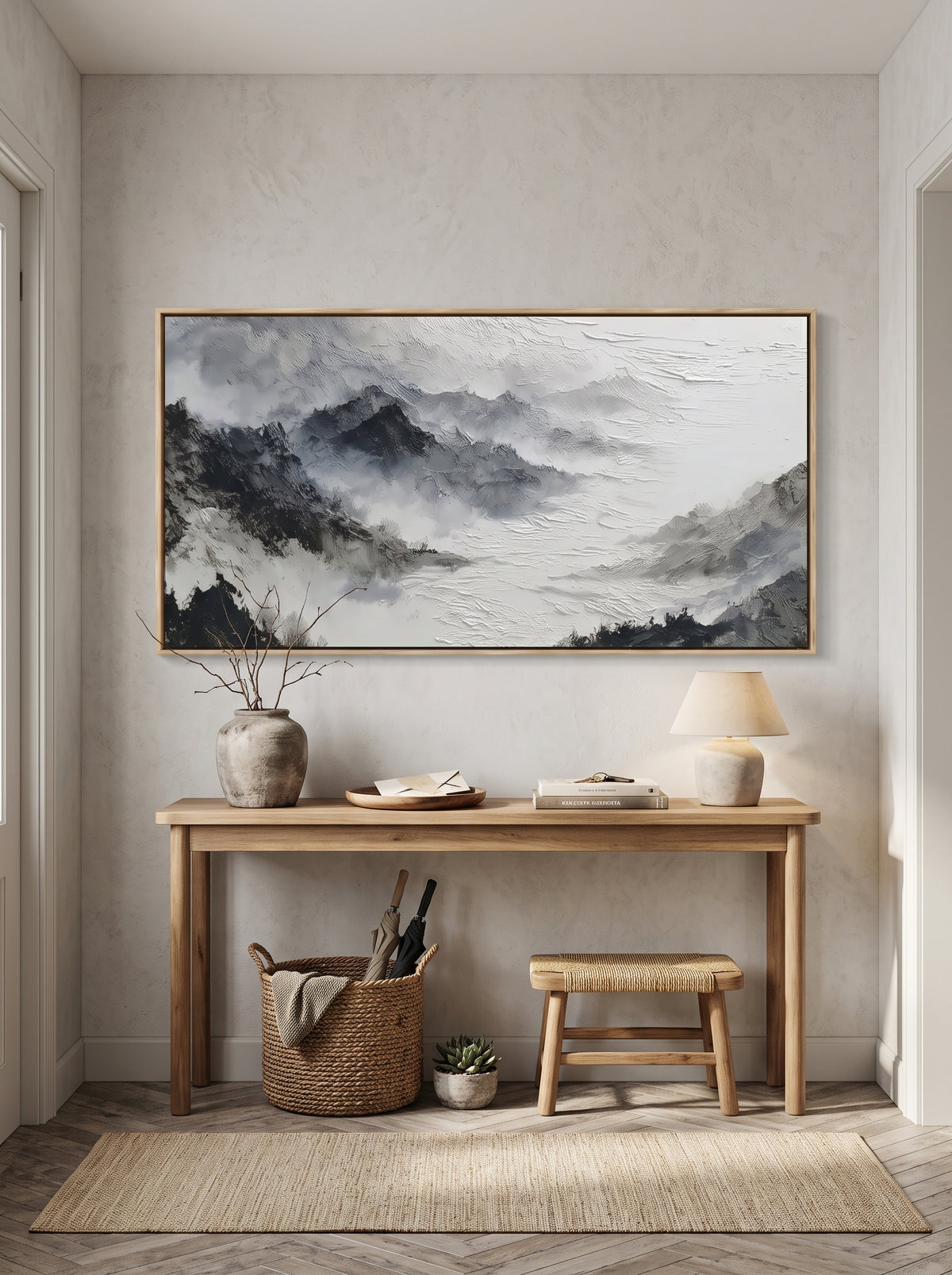 Textured horizontal alpine landscape canvas painting above modern console table in entryway