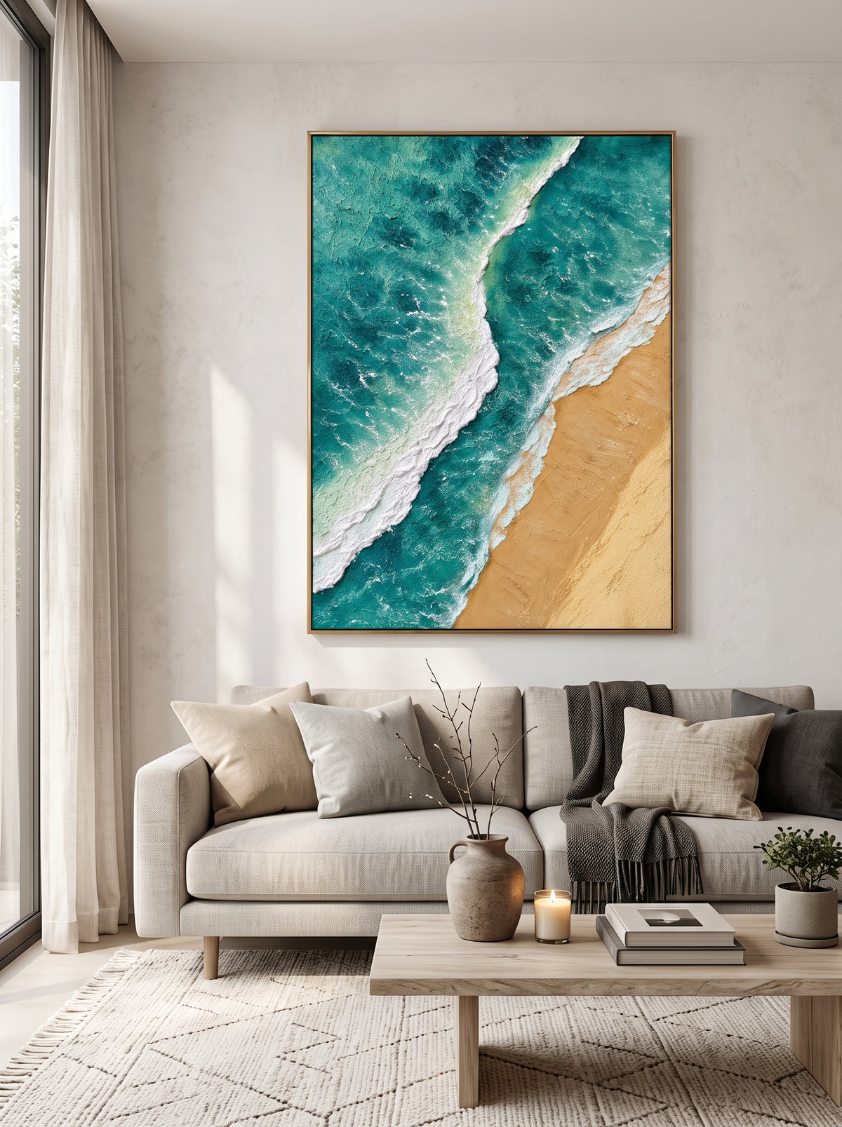 Vertical turquoise coastal wave canvas wall art displayed next to modern neutral sofa in bright living room