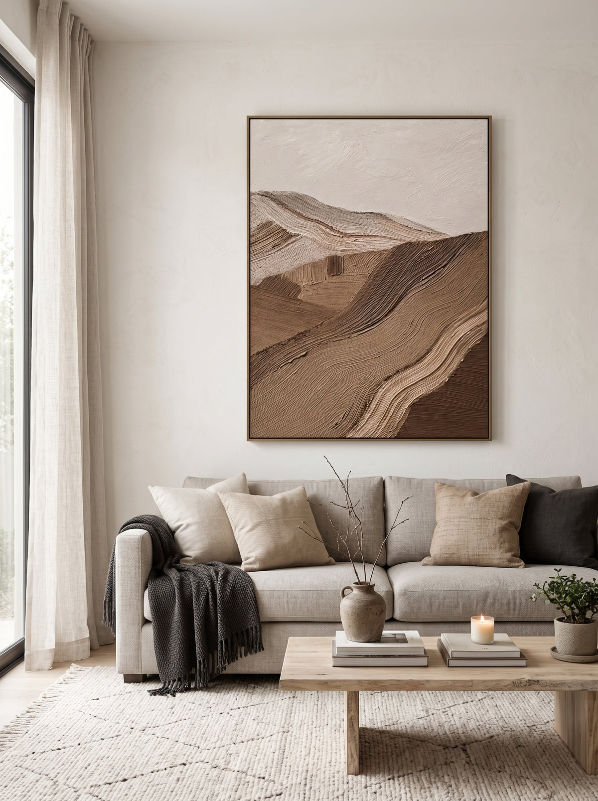 Large vertical warm earth-tone 3D ridge canvas wall art displayed next to modern neutral sofa in living room