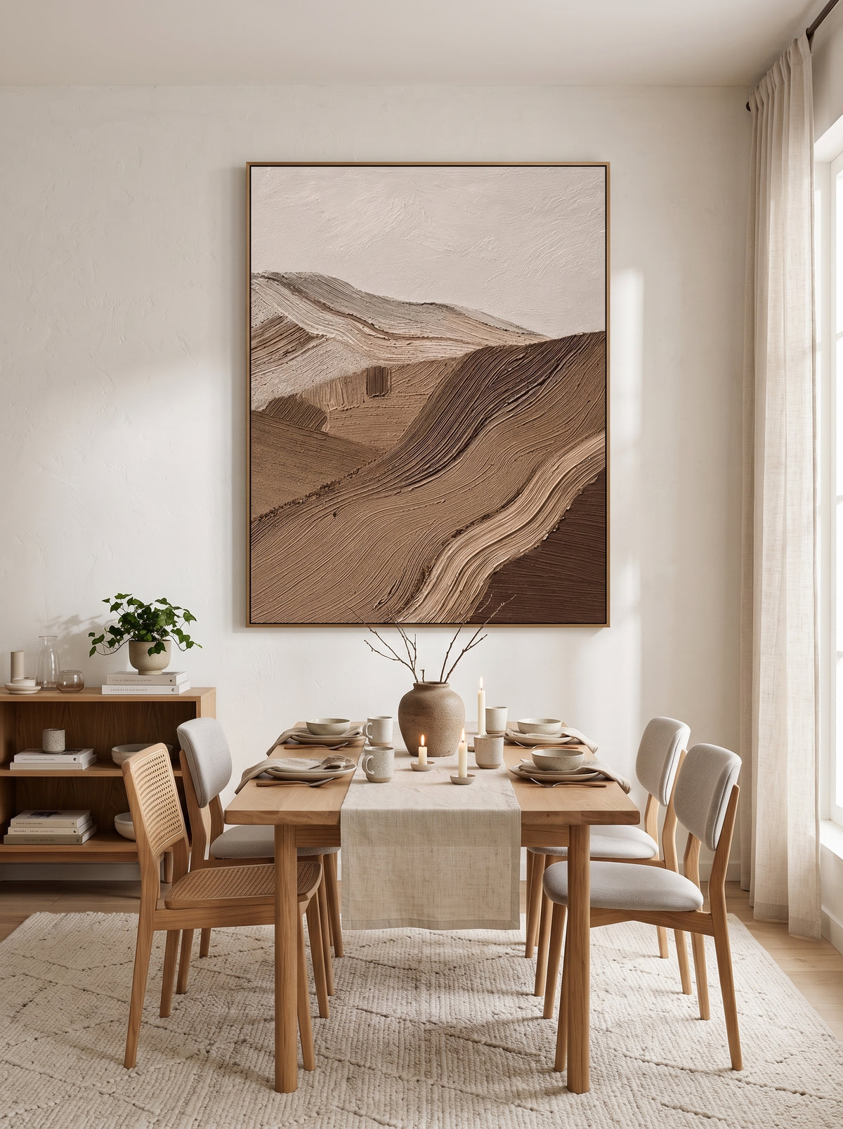 Framed vertical textured neutral mountain ridge painting mounted in modern dining room with oak furniture