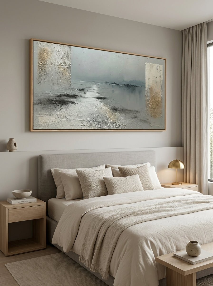 Minimalist calm lakeview oil painting hanging over a Japandi style wooden bedroom headboard