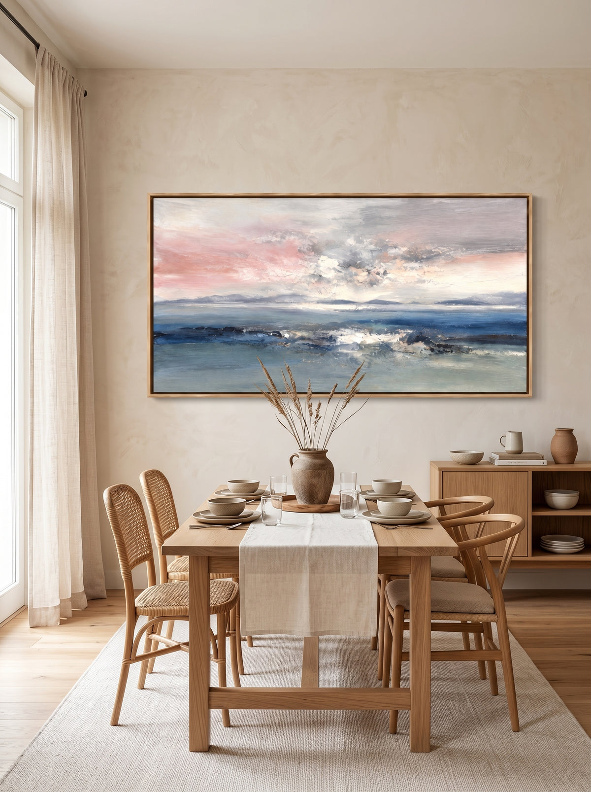 Textured abstract ocean seascape painting displayed in a modern open dining room with neutral interior décor.