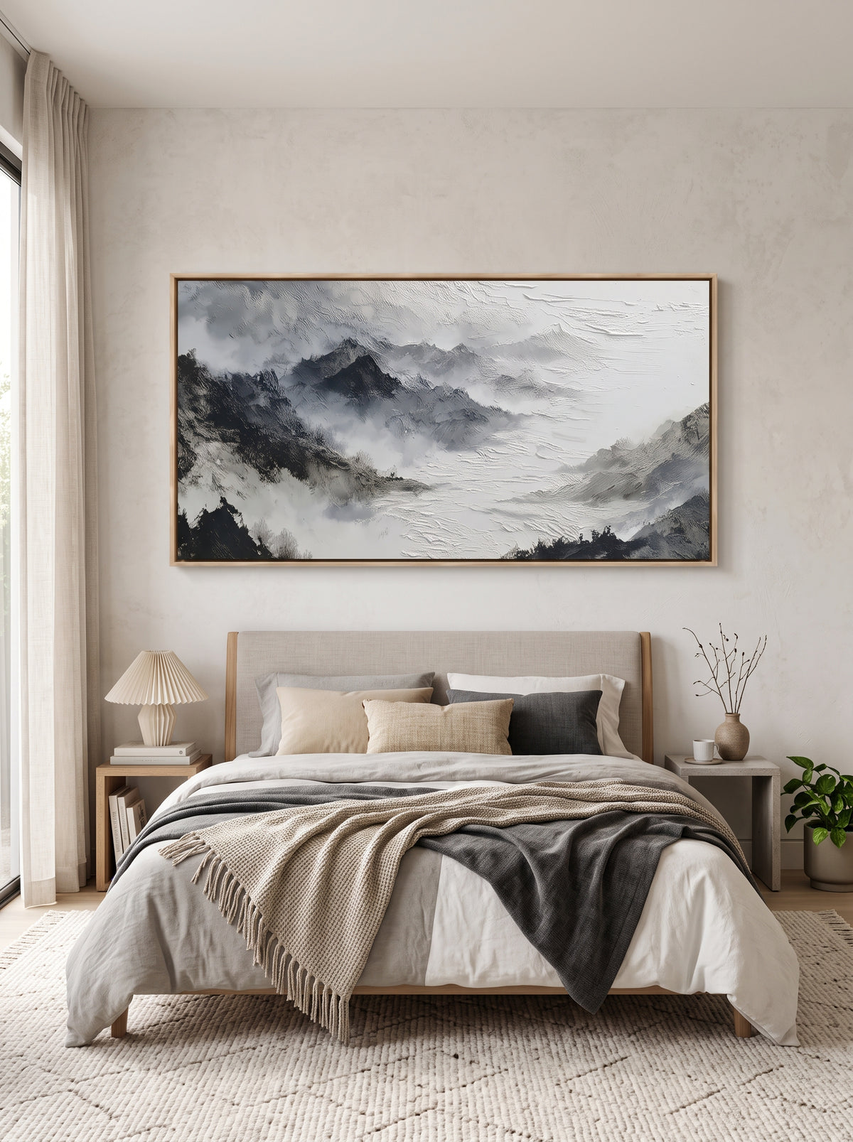 Calming black and white mountain valley wall art by Evelyn Li hanging above bed in contemporary bedroom