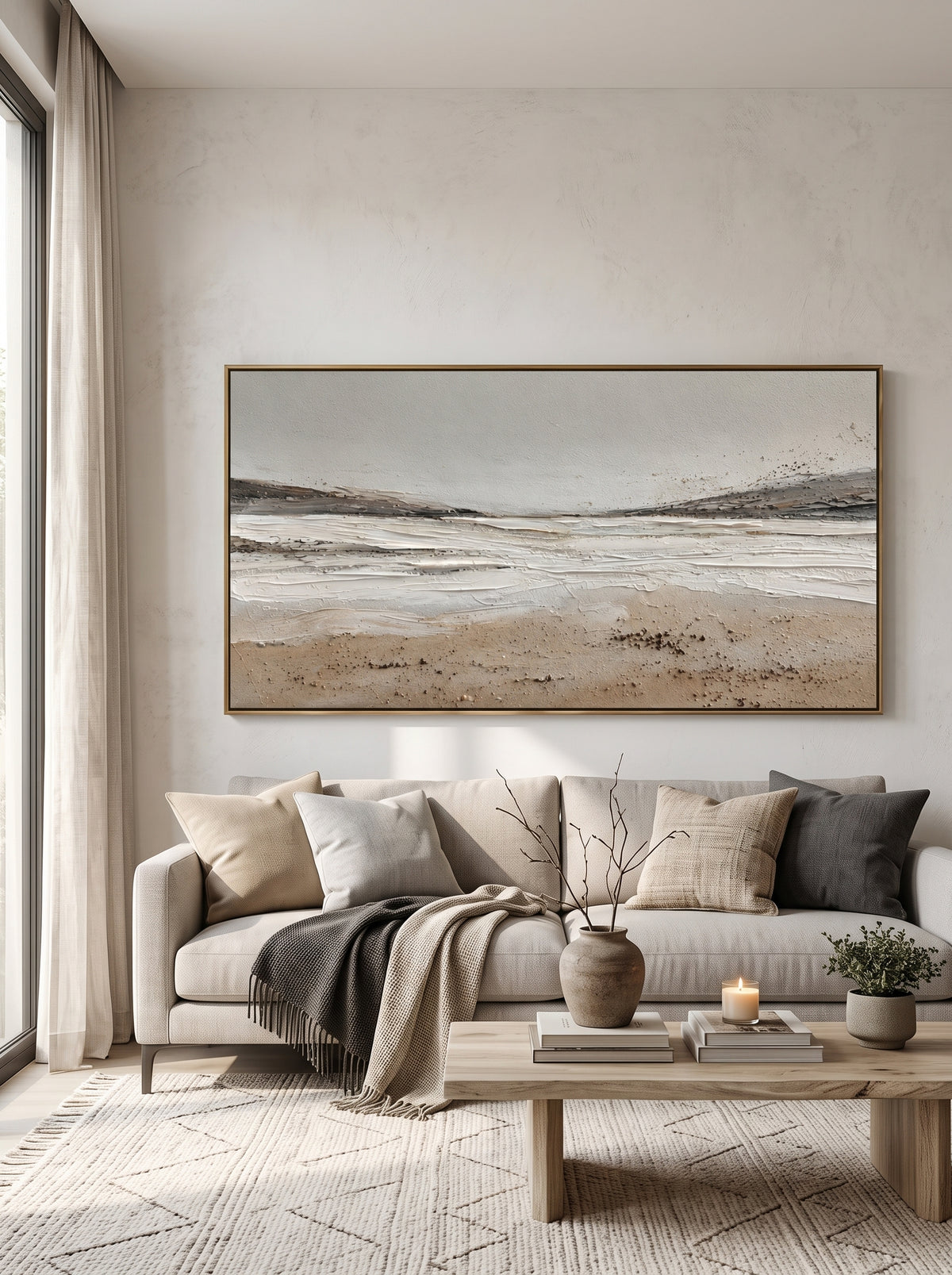 Large panoramic sand beige and white ocean wave canvas wall art above modern neutral sofa in living room