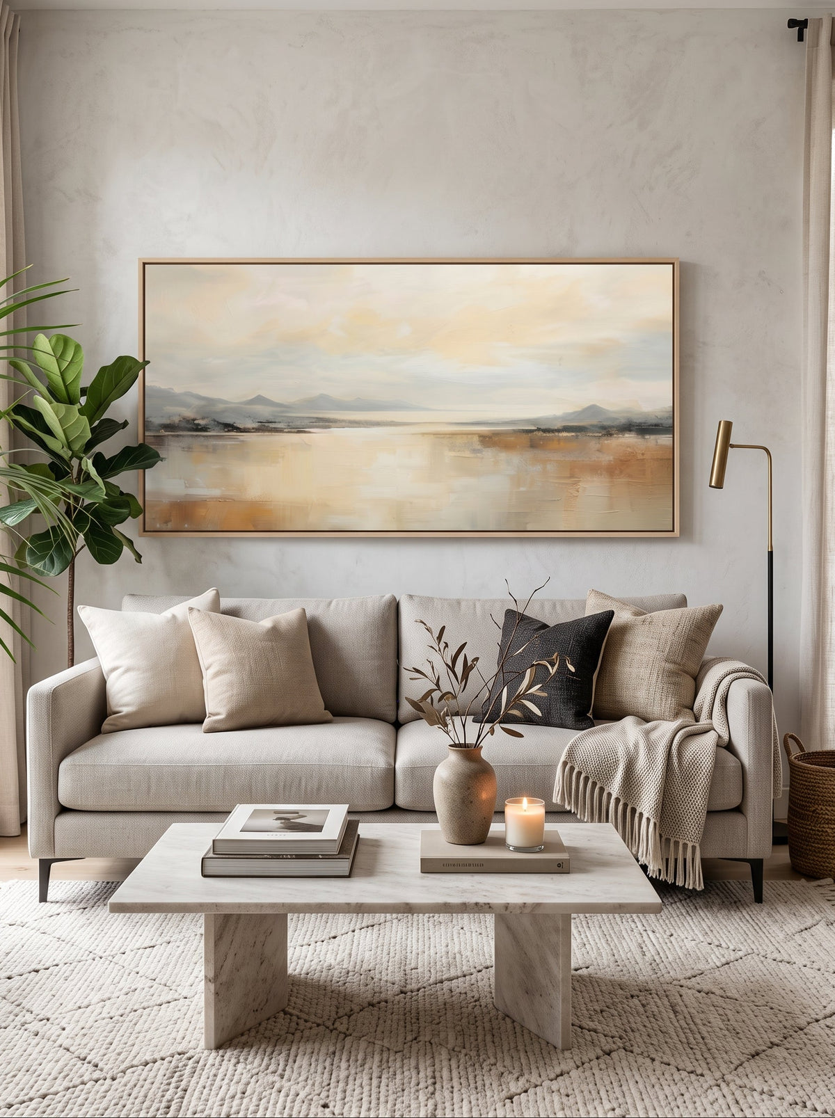 Large panoramic warm neutral landscape canvas wall art above modern sofa in open-plan living room