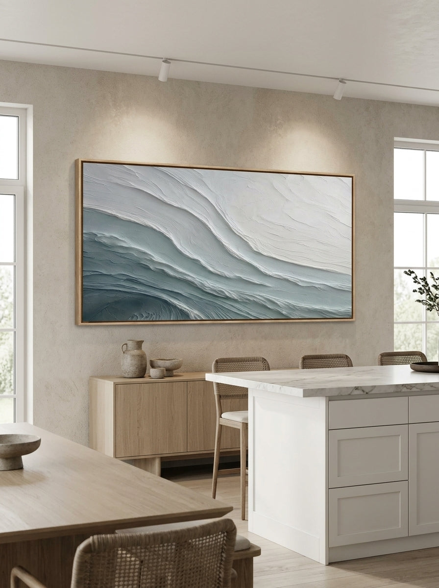Modern minimalist wave canvas wall art featured on a dining wall near an open kitchen interior