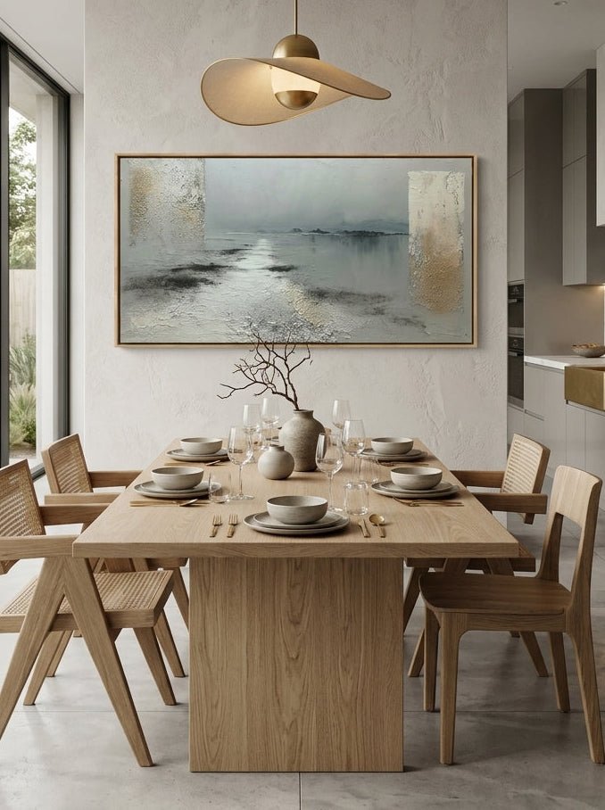 Muted grey coastal textured canvas wall art styled above an open concept dining room table