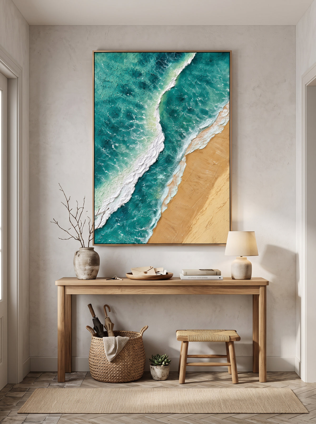 Vibrant textured turquoise sea painting mounted above minimalist console table in modern coastal foyer