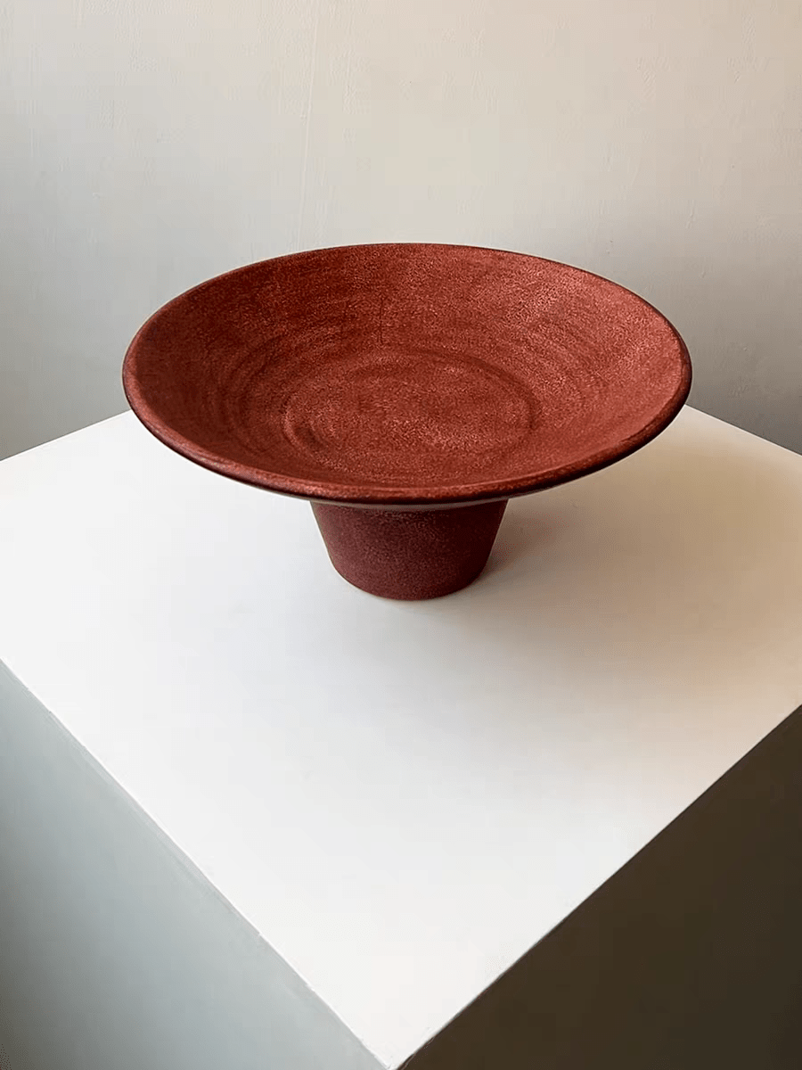 artisan ceramic geometric sculptures in matte rust red and black, modern minimalist architectural home decor on a white background.